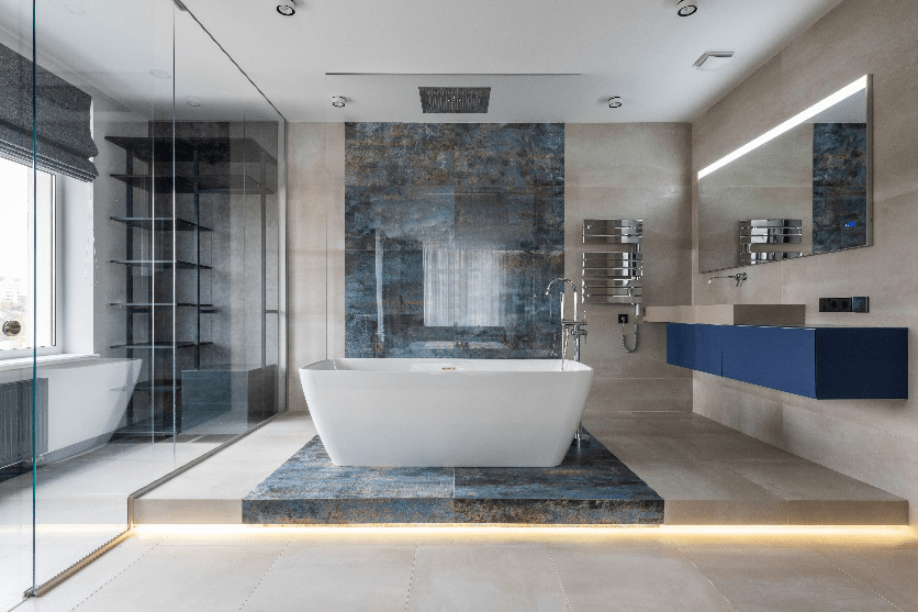 A modern bathroom with stone floors.